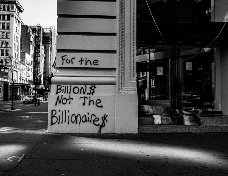 a sign that is on the side of a building, a black and white photo, by Meredith Dillman, pixabay, graffiti, wealth, billions of details, ffffound, post malone