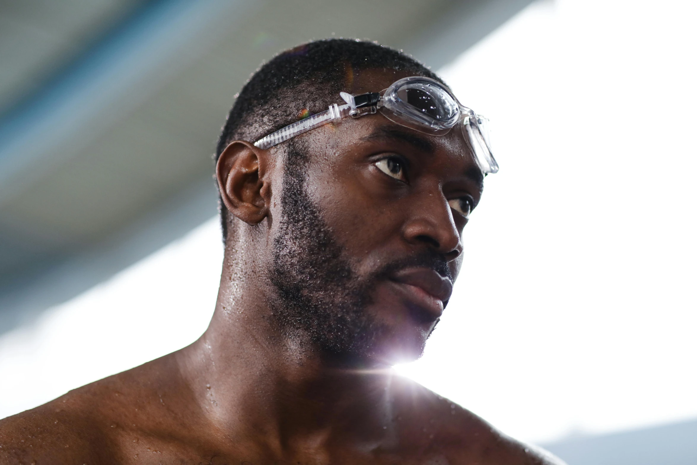 a close up of a person wearing goggles, by Thornton Willis, athletic man in his 30s, riyahd cassiem, gofl course and swimming, profile image