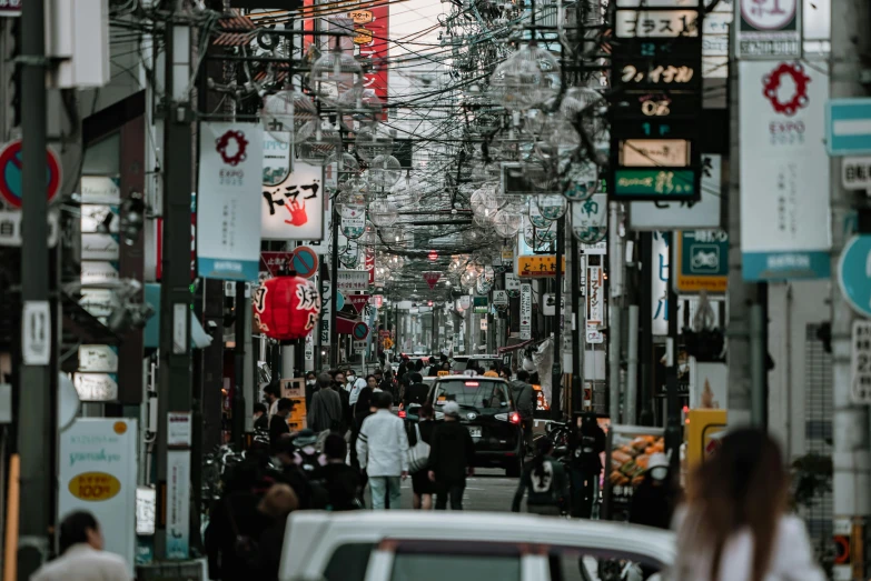 a busy city street filled with lots of traffic, a photo, pexels contest winner, ukiyo-e, wires hanging above street, thumbnail, 🦩🪐🐞👩🏻🦳, ethnicity : japanese