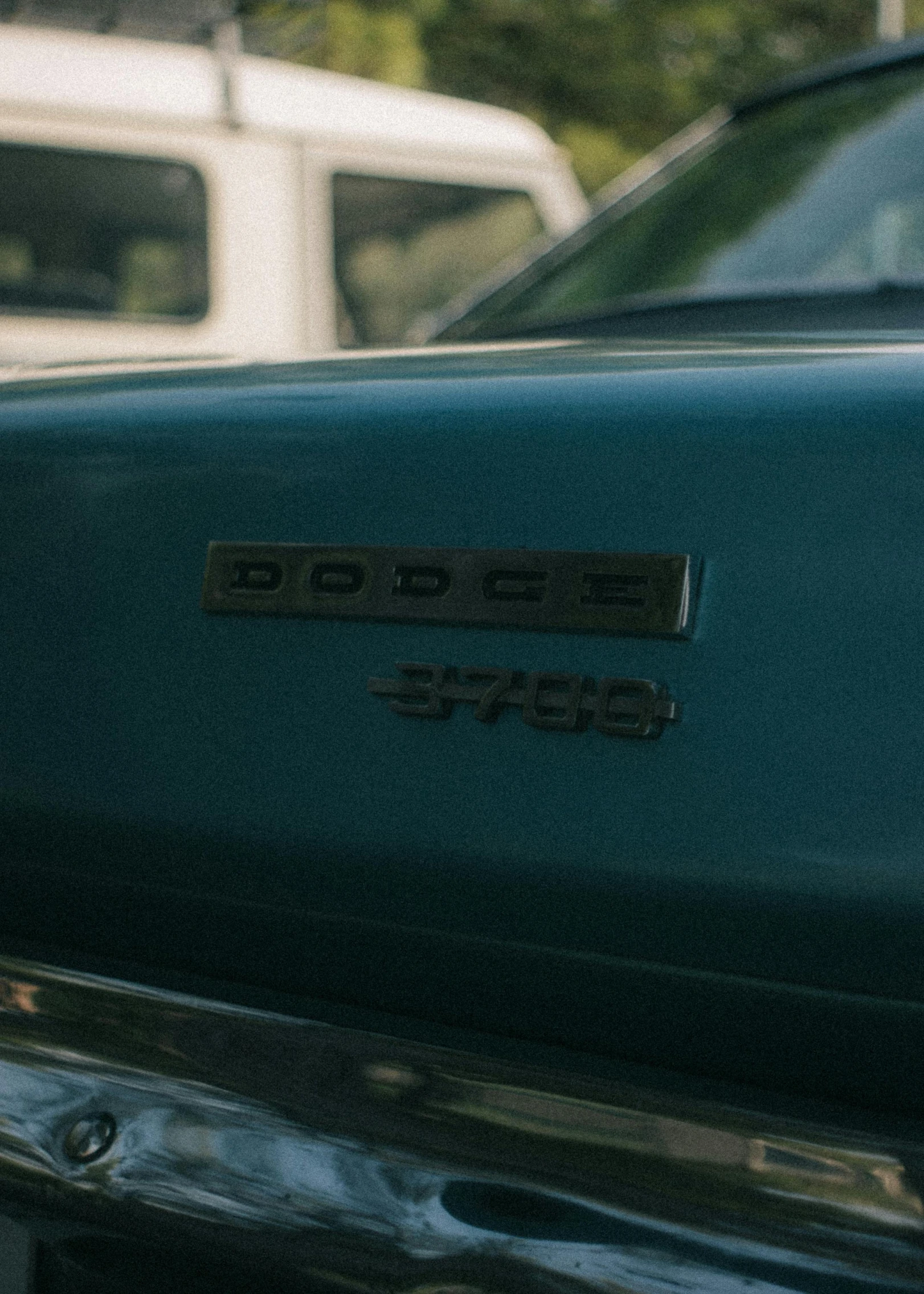 a close up of a car in a parking lot, by Carey Morris, pexels contest winner, renaissance, soft color dodge, teal color graded, profile image, 1977