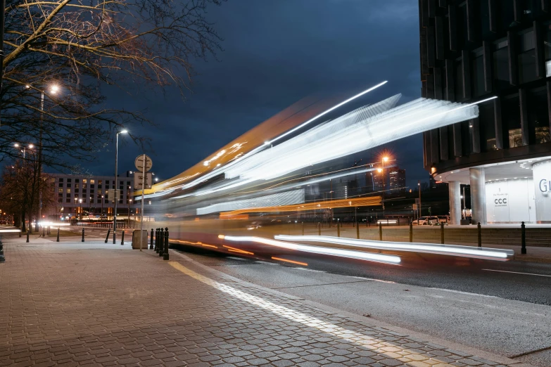 a double decker bus on a city street at night, by Daniel Seghers, unsplash, visual art, high speed motion, coventry city centre, thumbnail, sprawling