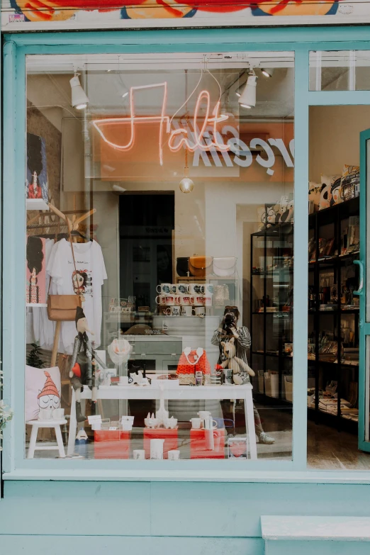 a store front with a sign in the window, unsplash contest winner, happening, in style of heikala, product display, halogen, lots of details