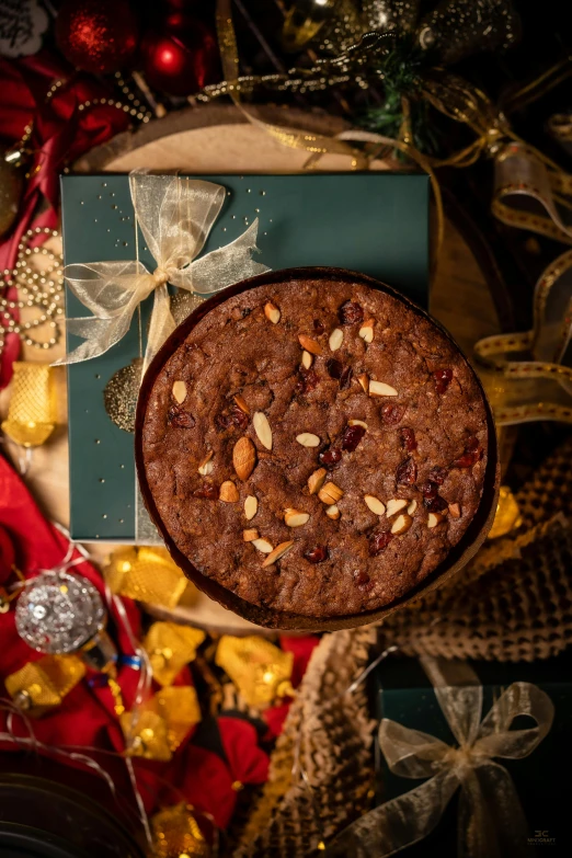 a cake sitting on top of a plate on top of a table, holiday season, full product shot, treasures, medium wide front shot