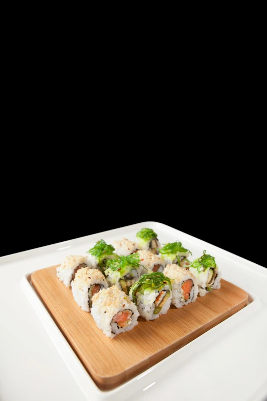 a close up of a plate of food on a table, on a wooden tray