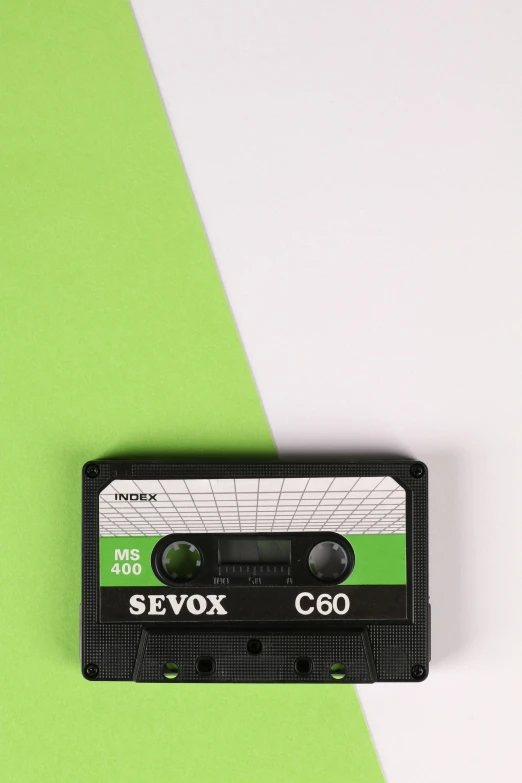 a close up of a cassette on a green and white background, by Sven Erixson, sovjet, cdx, charts, view