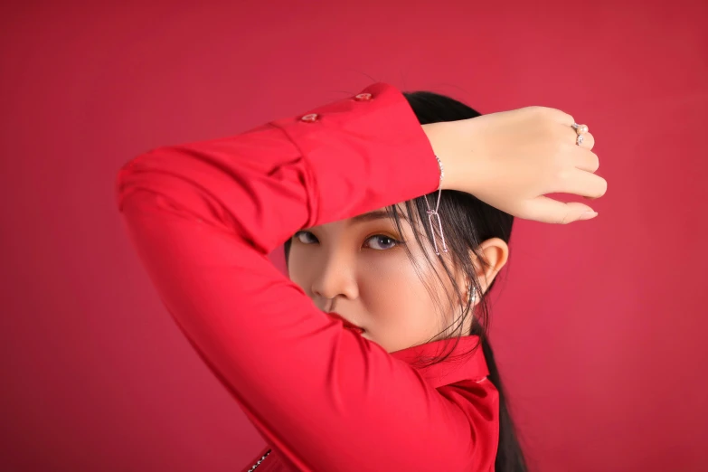 a woman in a red shirt posing for a picture, an album cover, inspired by Huang Ji, trending on pexels, glossy skin, tpose, jewelry, low iso