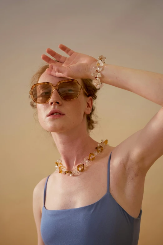 a woman in a blue tank top and sunglasses, a digital rendering, unsplash, renaissance, gold and pearl necklaces, pale light, amber jewels, curated collection