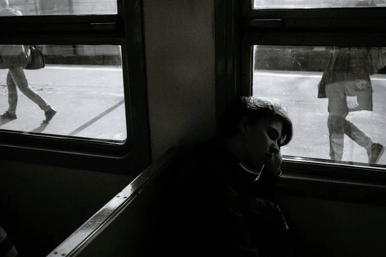 a man sitting next to a window on a train, a black and white photo, pexels contest winner, woman very tired, ilustration, artem chebokha, 3 am