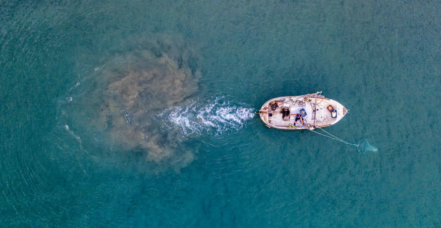 a boat in the middle of a body of water, pexels contest winner, auto-destructive art, flat lay, abel tasman, thumbnail, hunting