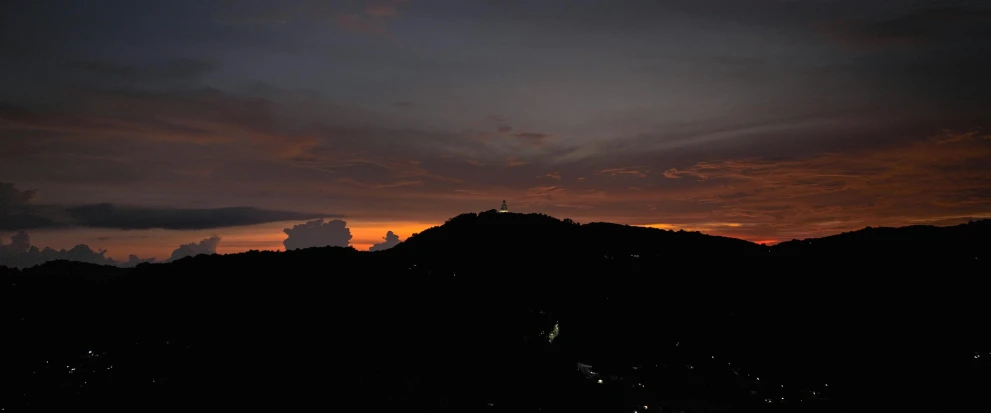 a view of a sunset from the top of a hill, by Jesper Knudsen, pexels contest winner, sumatraism, black, nightlight, panoramic view, brown