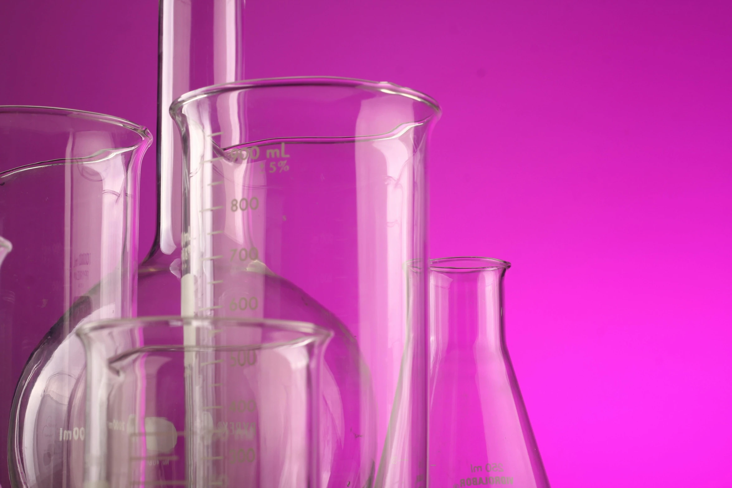 a group of glass flasks sitting on top of a table, pink violet light, formulas, detailed product image, close-up!!!!!