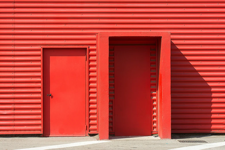 a fire hydrant in front of a red building, a photo, inspired by Donald Judd, postminimalism, 3 doors, metal cladding wall, shed, exiting store