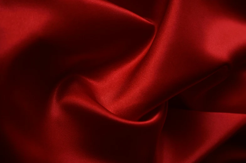 a close up of a red satin fabric