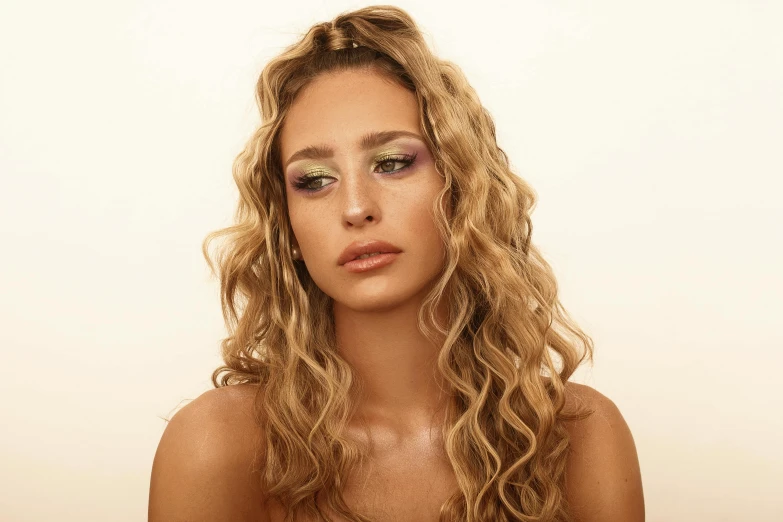 a close up of a woman with long hair, an album cover, trending on pexels, photorealism, long blond drill curls, iridescent highlights, middle eastern skin, model posing