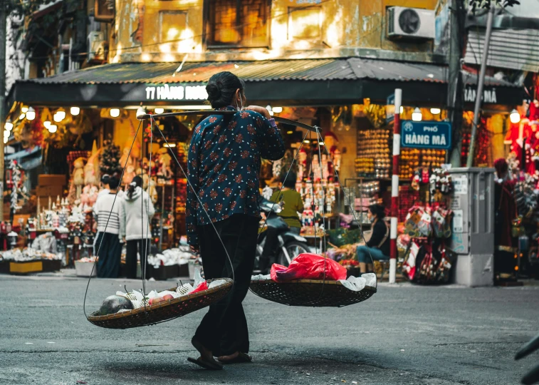 a man walking down a street with a basket on his back, pexels contest winner, vietnamese woman, quirky shops, profile image, youtube thumbnail