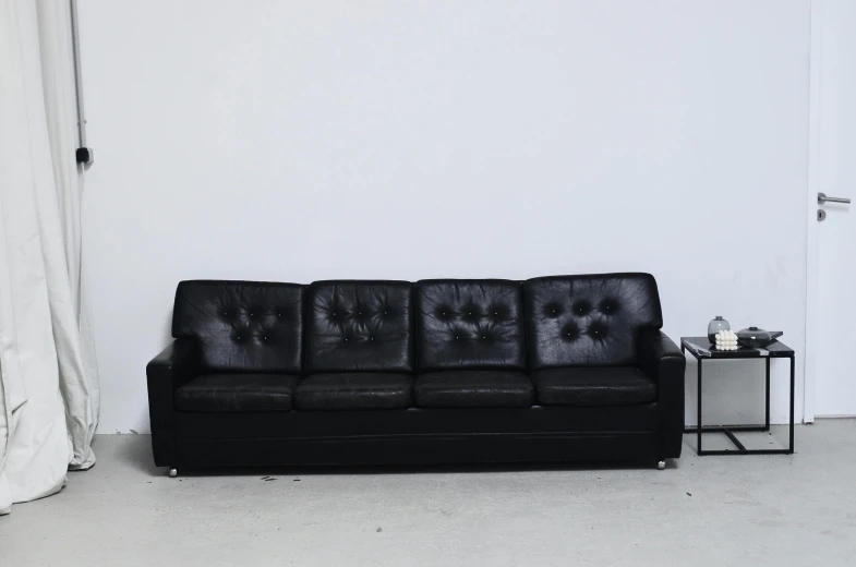 a black leather couch in a white room, an album cover, highly detailed-h 704, ( ( dieter rams ) ), imperial brutalist base, vintage - w 1 0 2 4