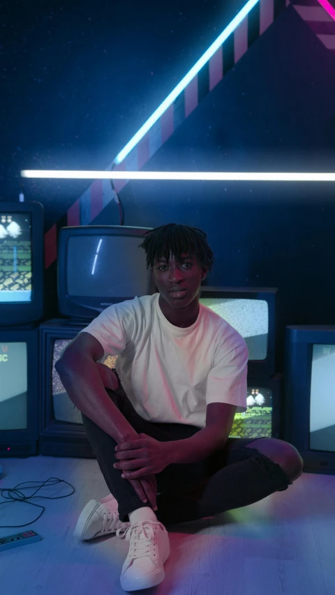 a man sitting in front of a bunch of televisions, an album cover, inspired by Xanthus Russell Smith, unsplash contest winner, video art, model posing, black teenage boy, 2 1 savage, glowing