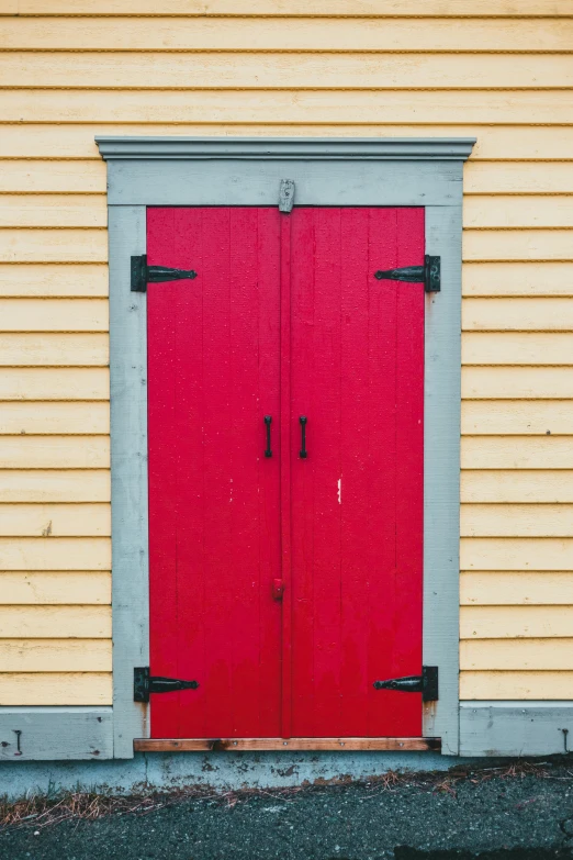 a red door in front of a yellow house, square, today's featured photograph, harbor, paul barson