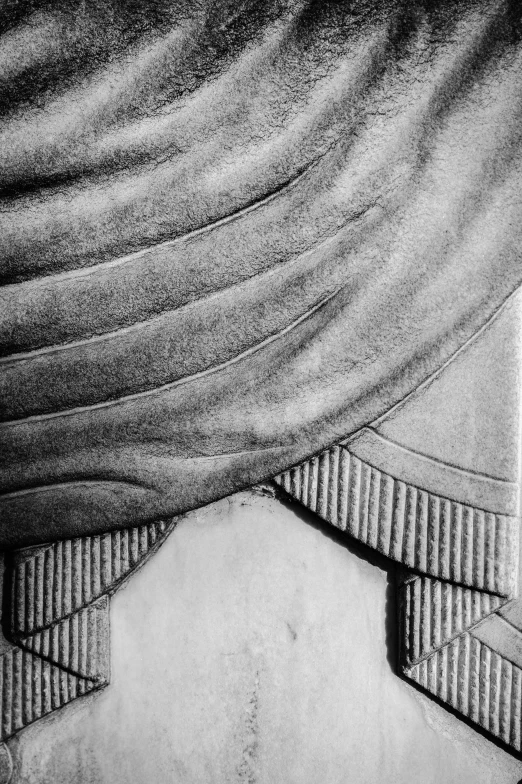 a black and white photo of a man in a turban, an abstract drawing, inspired by Pietro Testa, reddit, concrete art, detail structure, large draped cloth, cartouche, relief