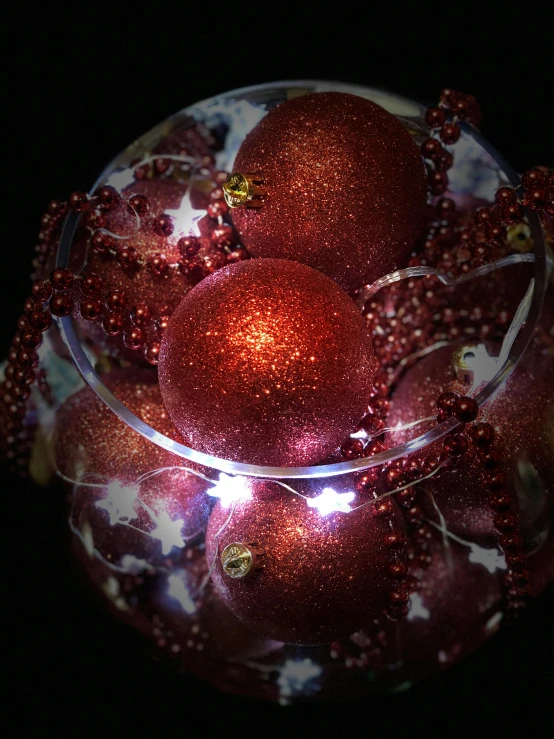 a glass bowl filled with red christmas ornaments, a photo, by Georgina Hunt, happening, small led lights, ilustration, medium closeup, product display photograph