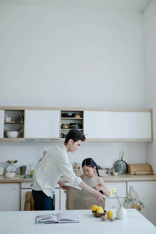 a man and a woman in a kitchen preparing food, by Tan Ting-pho, unsplash, square, minimal kitchen, children, cream