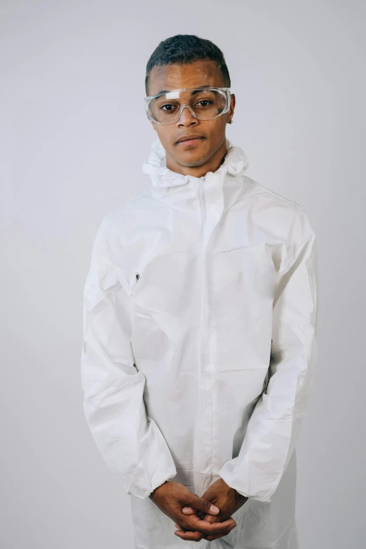a man wearing a white lab coat and glasses, an album cover, unsplash, hyperrealism, hooded, wearing human air force jumpsuit, male teenager, ariel perez
