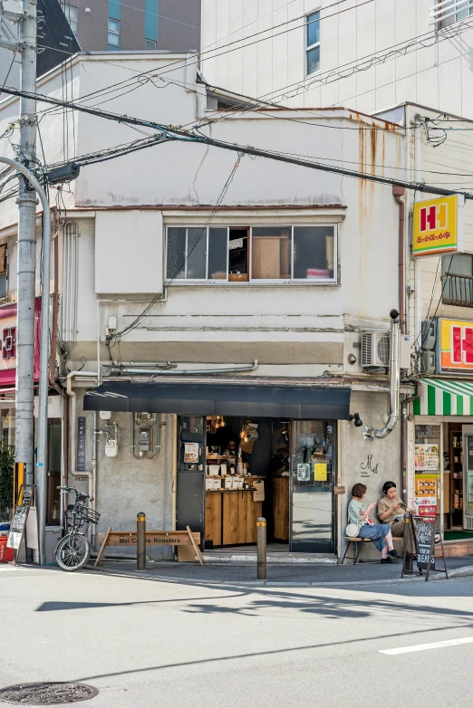 a couple of people that are standing in the street, shin hanga, storefront, street elevation, exterior