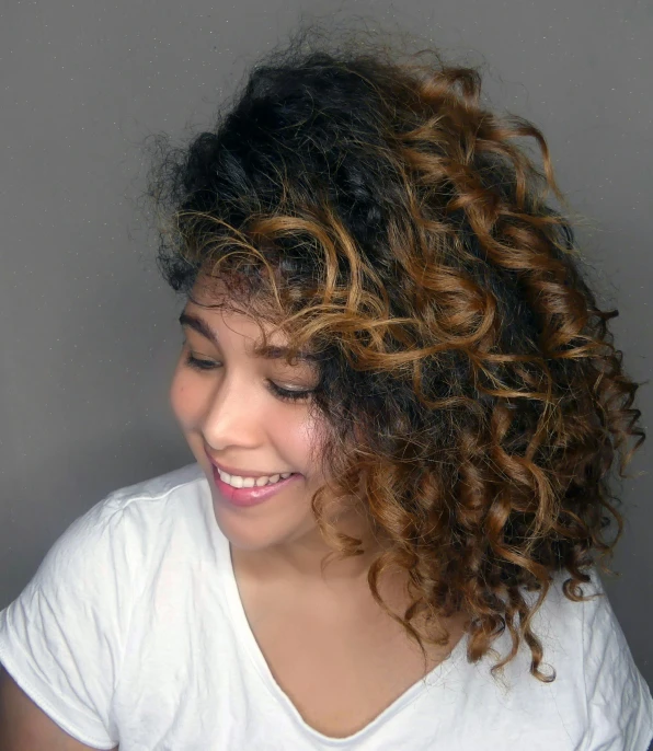 a close up of a person with a cell phone, brown curly hair, soft highlights, profile image, nivanh chanthara