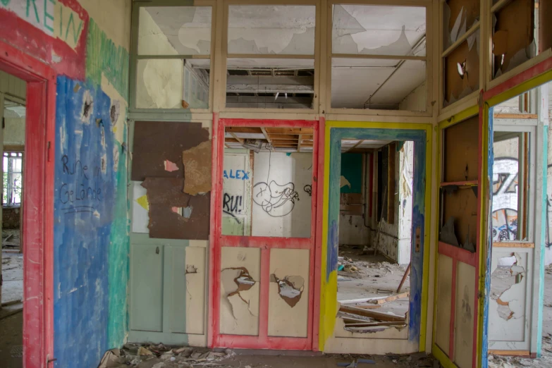 a run down building with graffiti on the walls, a portrait, school classroom, multi - coloured, doorway, demolition