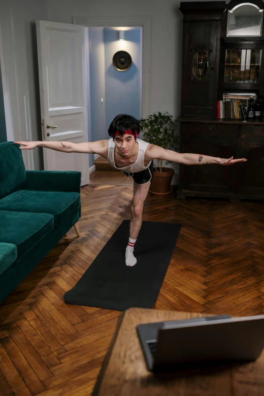 a woman doing a yoga pose in a living room, by Carey Morris, pexels contest winner, renaissance, twitch streamer, finn wolfhard, standing athletic pose, his legs spread apart