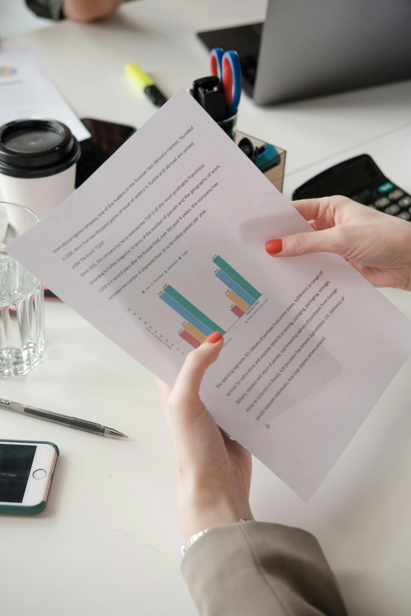 a person sitting at a desk holding a piece of paper, analysis report, colour corrected, thumbnail, multiple stories