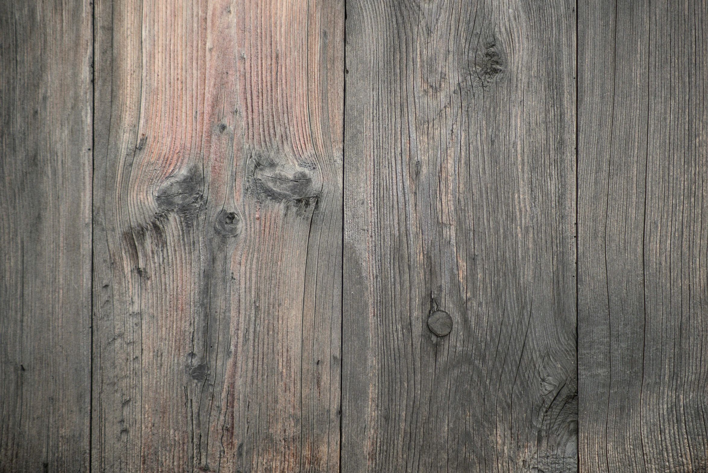 a close up of a wooden fence with knots, an album cover, trending on pexels, baroque, dark grey, 4 k texture pack, gradient brown to silver, puce and vermillion