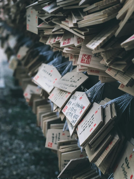 a bunch of boxes stacked on top of each other, inspired by Itō Jakuchū, unsplash contest winner, lots of signs, japanese shrine, magical notes, hanging trees