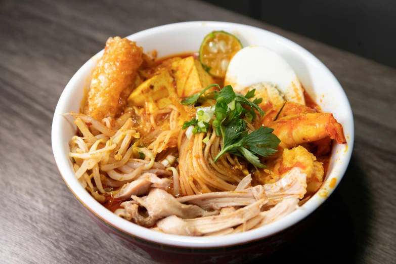 a close up of a bowl of food on a table, square, noodles, bangkuart, chicken