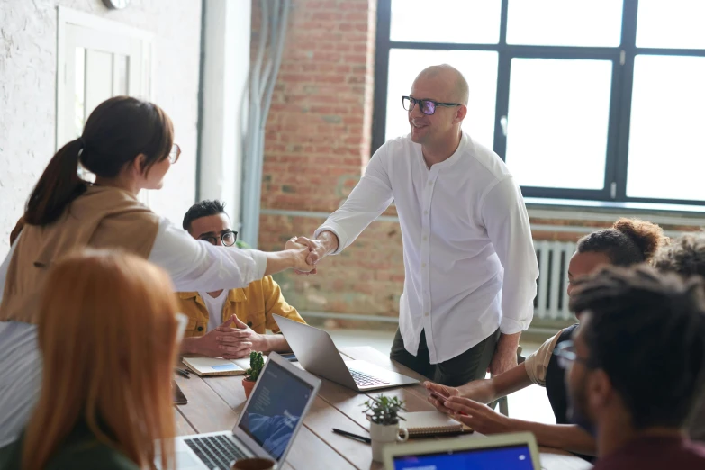 a group of people sitting around a table with laptops, pexels contest winner, shaking hands, paul barson, avatar image, profile picture