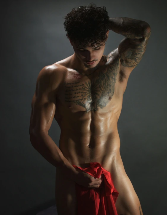 a shirtless man holding a red towel, a tattoo, by Cosmo Alexander, shutterstock contest winner, art photography, non binary model, veins popping out, korean muscle boy 2 1 years old, profile pic