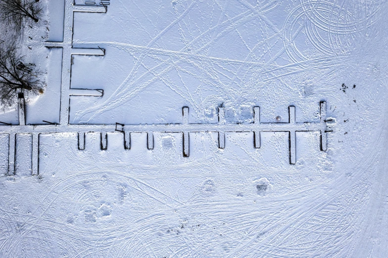 a group of people riding skis down a snow covered slope, an album cover, inspired by Matthias Jung, land art, drone view, square lines, thumbnail, frosted