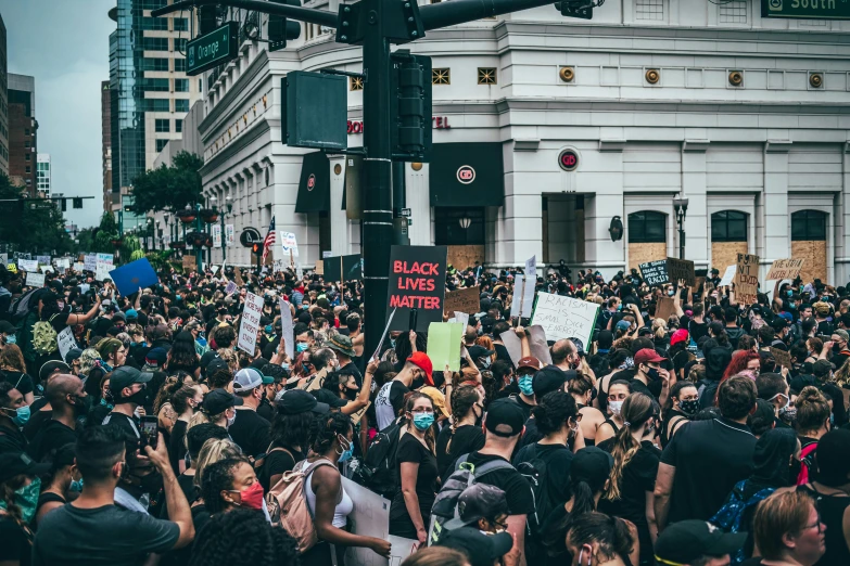 a large crowd of people on a city street, a photo, by Carey Morris, pexels, renaissance, violent protest, black, youtube thumbnail, panel of black
