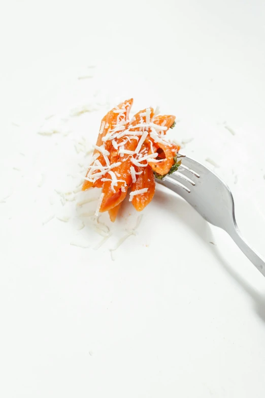 a close up of a fork with food on it, white and orange, crushed, italian, with a white background