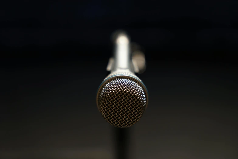 a close up of a microphone on a stand, paul barson, hyperrealistic content, medium-shot, single