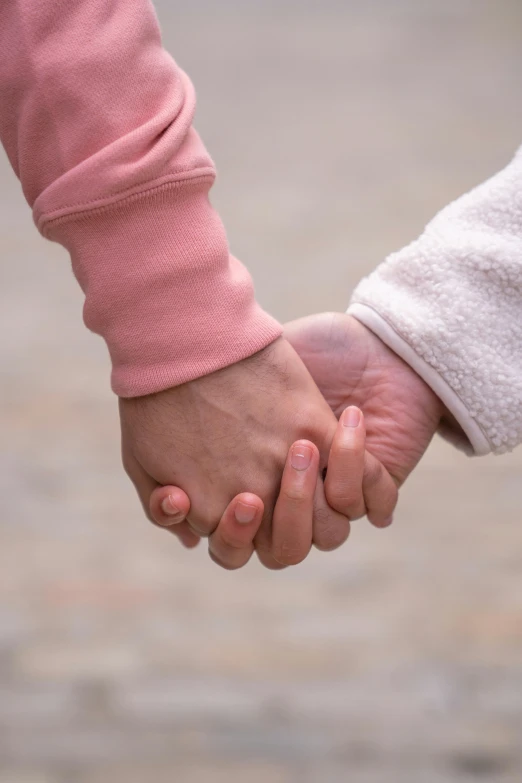 a close up of two people holding hands, by Lilia Alvarado, unsplash, incoherents, transgender, square, children's, 15081959 21121991 01012000 4k