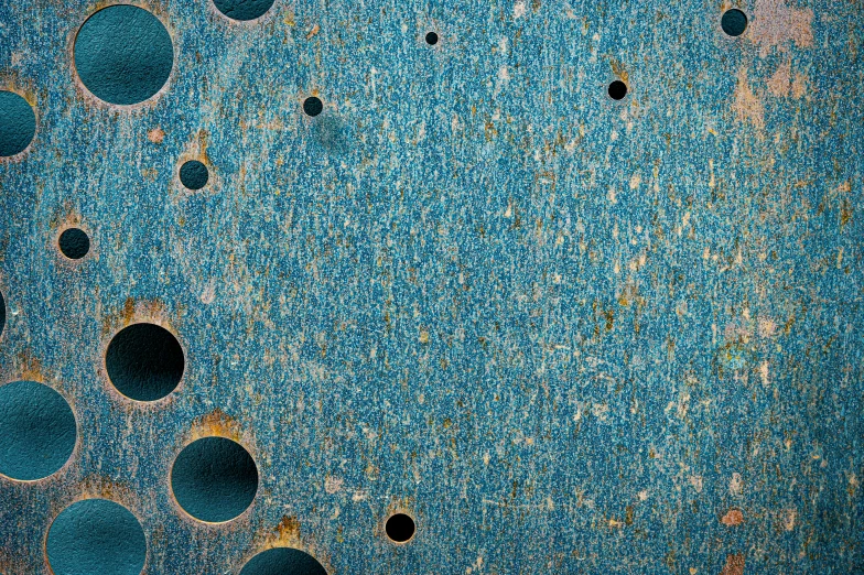 a close up of a metal surface with holes, an album cover, inspired by Max Ernst, flickr, soft blue texture, archival pigment print, ffffound, high resolution product photo
