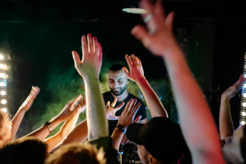 a group of people raising their hands in the air, a portrait, pexels contest winner, dj at a party, artem chebokha, teddy fresh, thumbnail