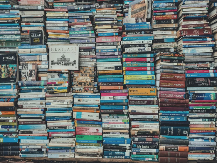 a pile of books stacked on top of each other, pexels, maximalism, a wide full shot, snapchat photo, background image, shot from cinematic