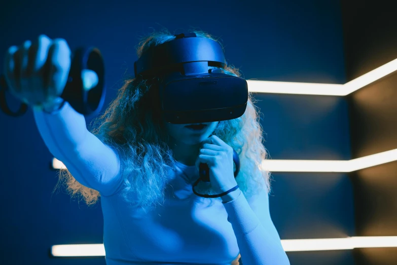 a woman wearing a virtual reality headset, unsplash, interactive art, brightly lit blue room, triumphant pose, navy, thumbnail