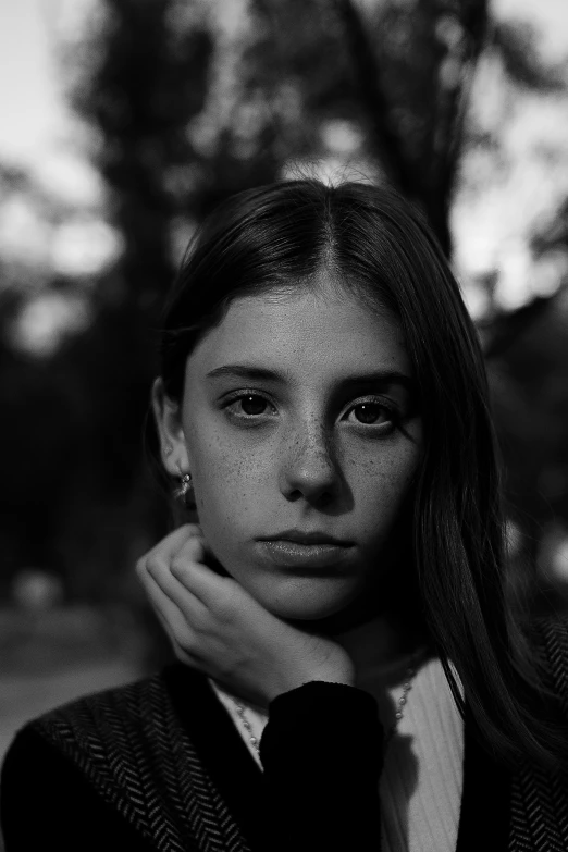 a black and white photo of a woman in a suit and tie, a black and white photo, by Alexis Grimou, pexels contest winner, hyperrealism, portrait of normal teenage girl, girl in raincoat, white freckles, pouty