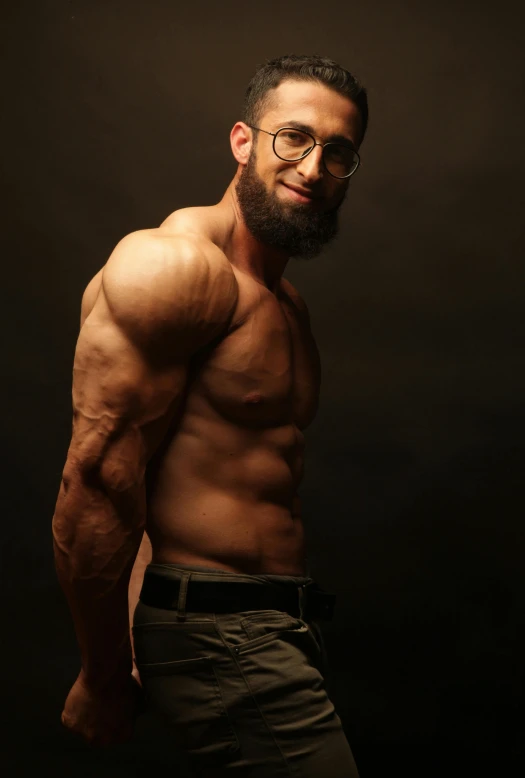 a man with a beard and glasses posing for a picture, an album cover, by Shaddy Safadi, pexels contest winner, bare bodybuilder shoulders. kohl, jewish young man with glasses, vascularity, side pose