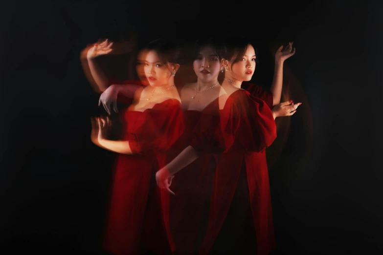 three women in red dresses standing next to each other, an album cover, inspired by Jiang Tingxi, unsplash, lightpainting, multiple poses, obscured underexposed view, yanjun chengt