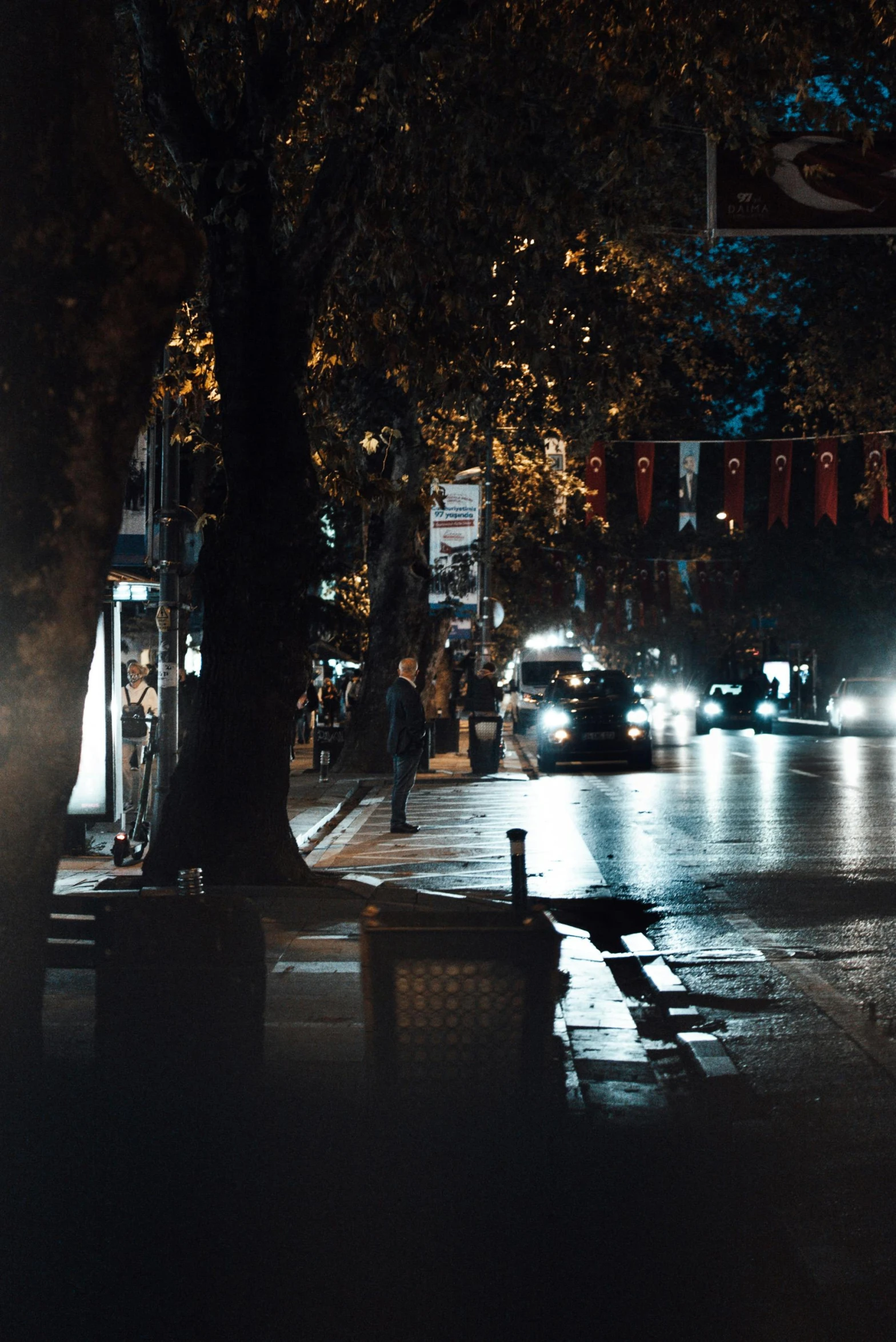 a city street filled with lots of traffic at night, laos, dark and moody aesthetic, background image, sitting down