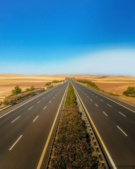 an empty highway in the middle of nowhere, an album cover, unsplash, fantastic realism, seville, lgbtq, panoramic photography, square